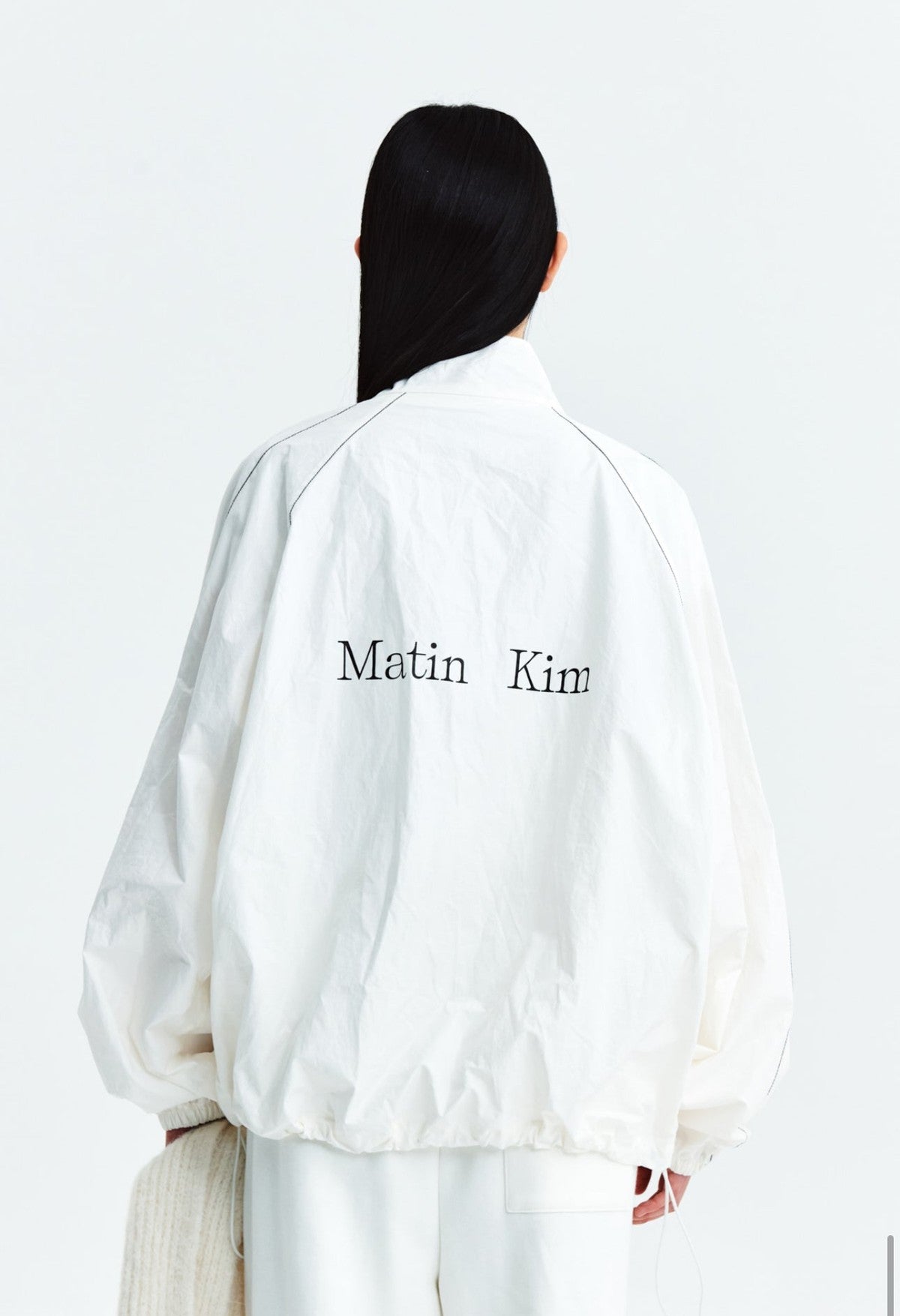 MATIN KIM LOGO COATING JUMPER IN IVORY (Instock)