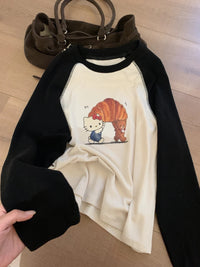 Kelly Designs Hello Kitty Croissant Graphic Raglan Tee – Black & Cream (Instock)